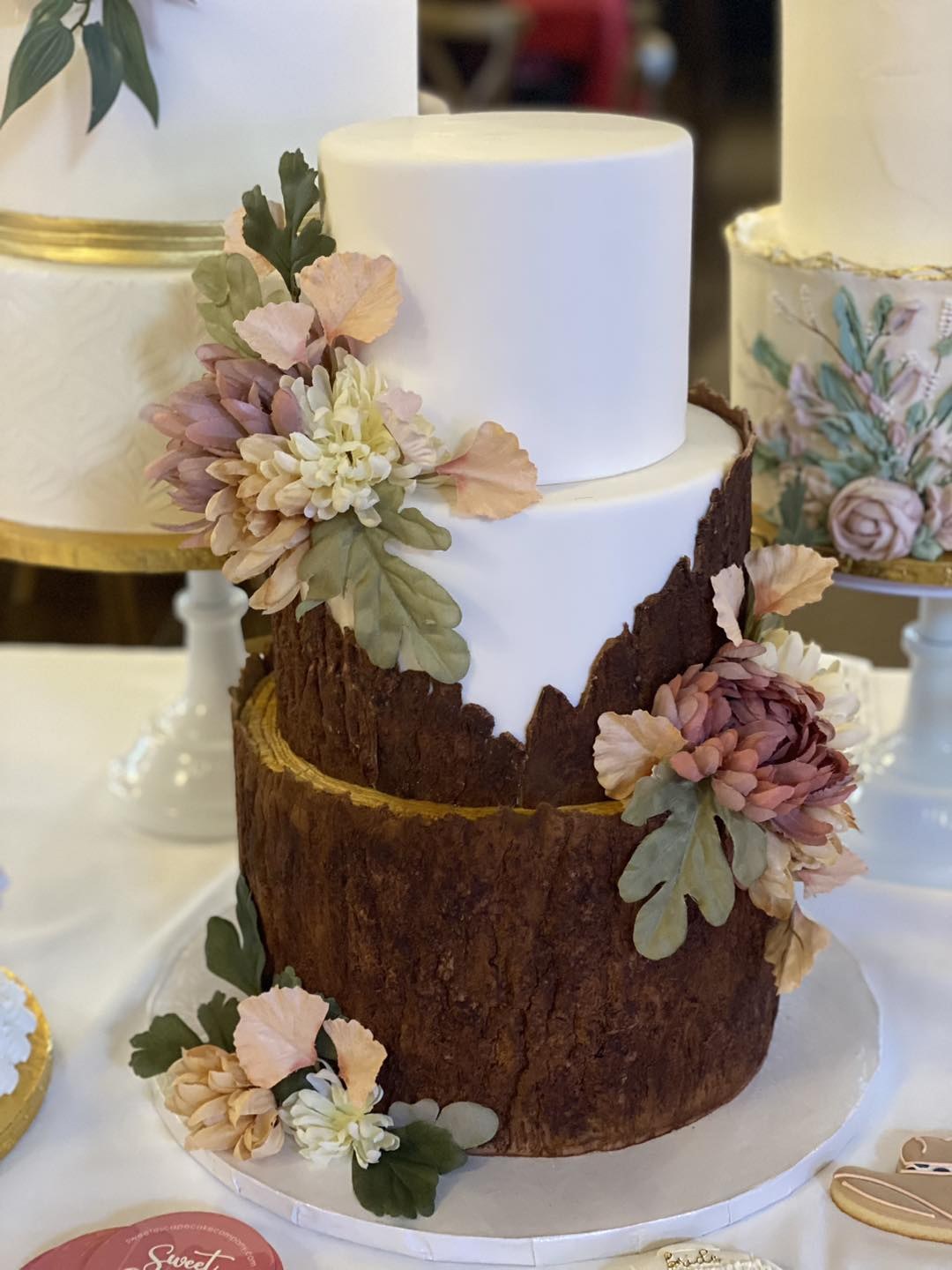 A rustic textured three-tier wedding cake showing a 2026 Indianapolis wedding cake trend.