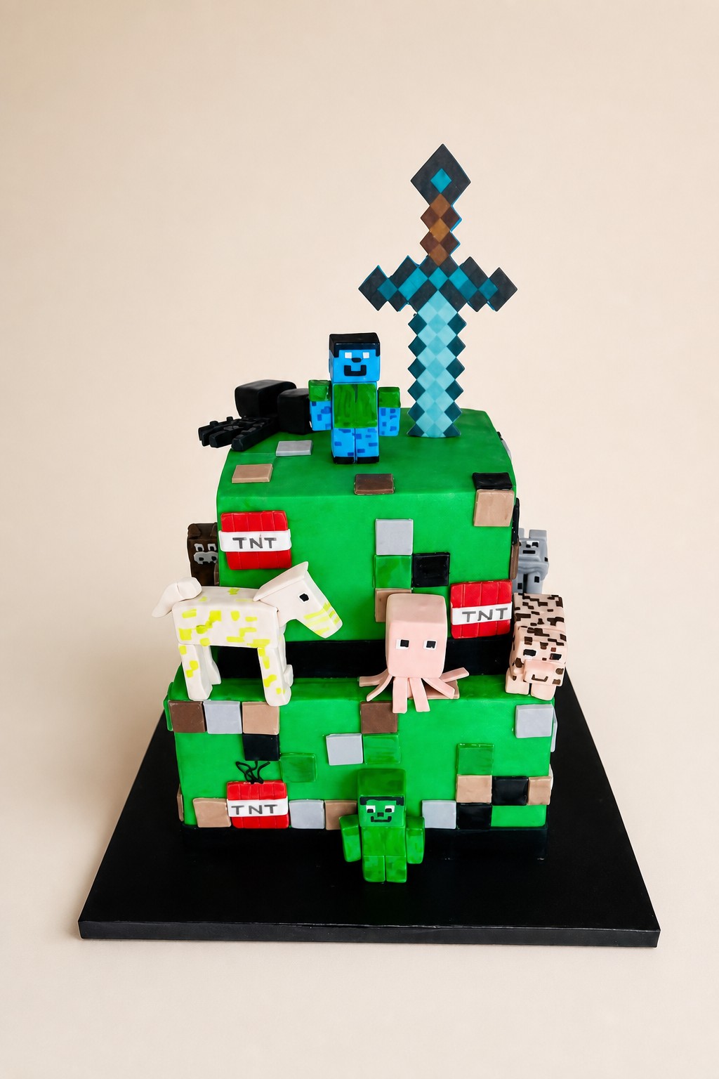 A vibrant two-tier square Minecraft-themed birthday cake featuring various sculpted fondant characters like Steve, Creeper, pig, horse, and 