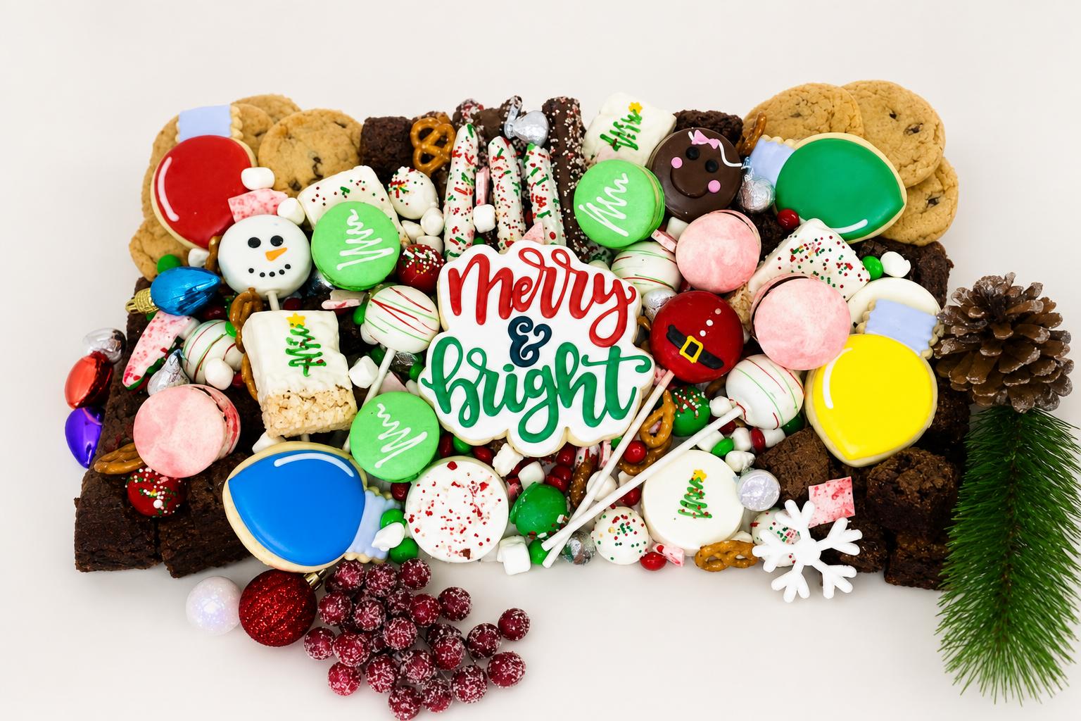 A vibrant Christmas holiday dessert bar featuring an assortment of festive decorated cookies, colorful macarons, chocolate-dipped pretzels, 