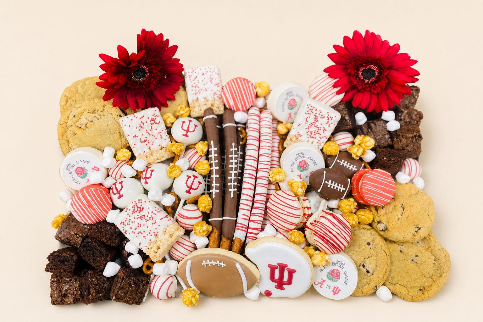 A vibrant football-themed dessert bar featuring decorated cookies, brownies, chocolate-covered pretzels, rice krispie treats, and cake pops,