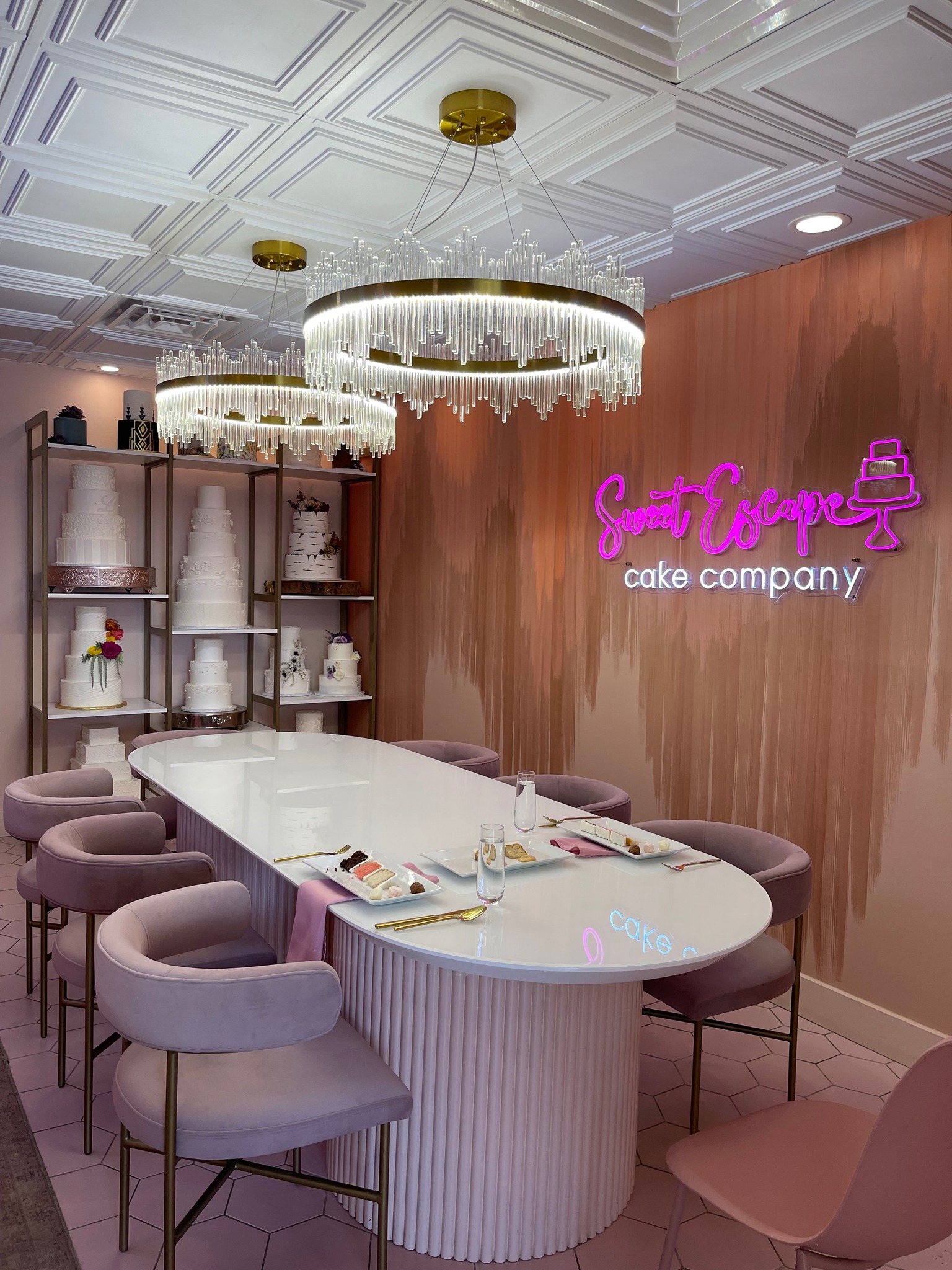 The tasting room at Sweet Escape Cake Company, with wedding cakes on display