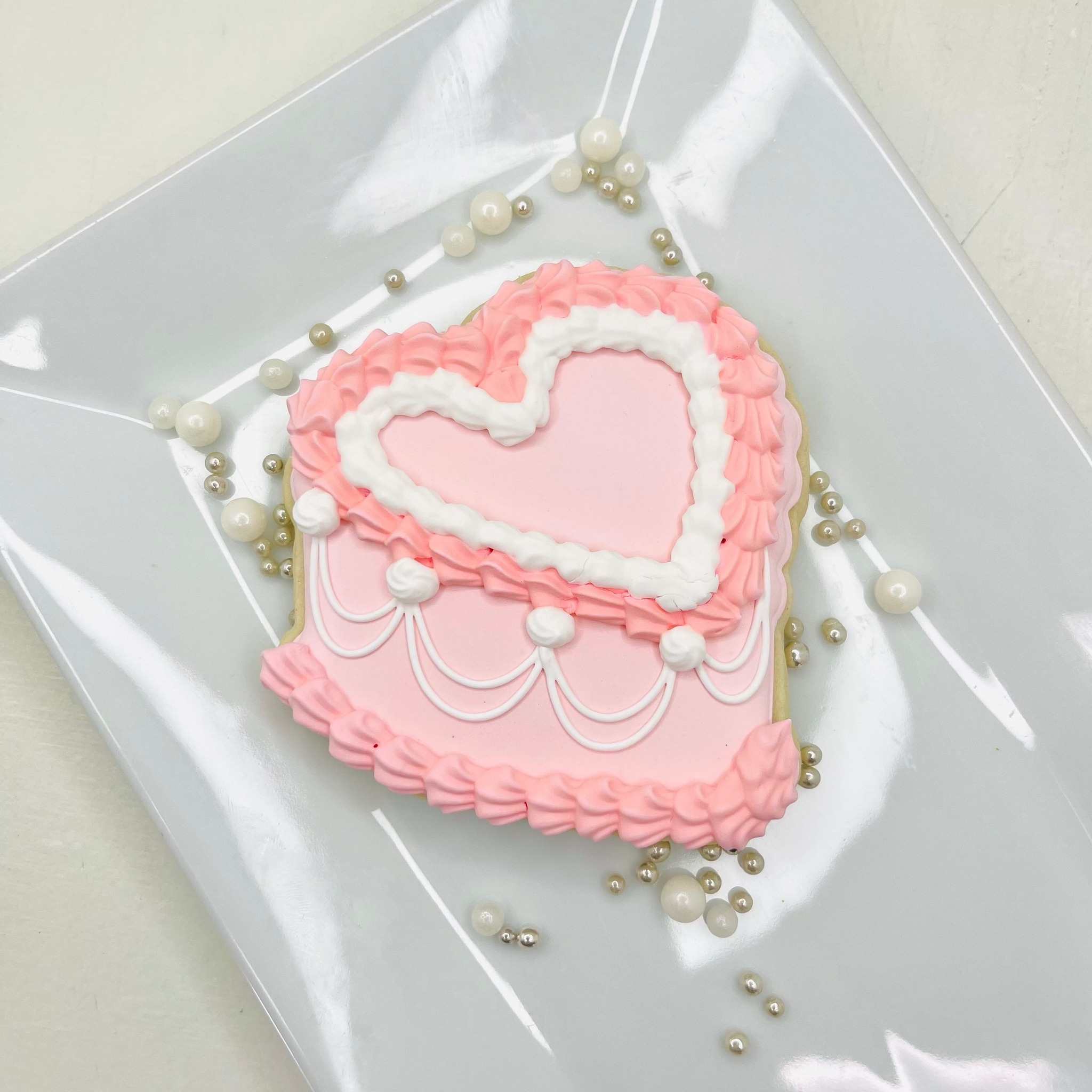 Hand-decorated royal iced sugar cookie close-up